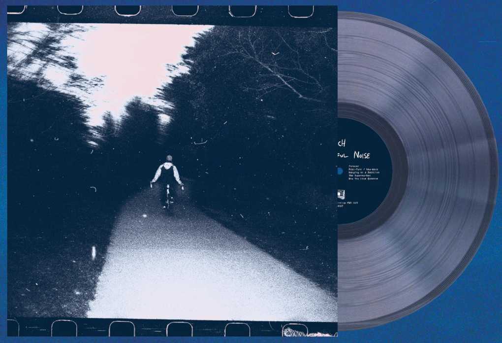The Beautiful Noise sleeve alongside the clear vinyl record